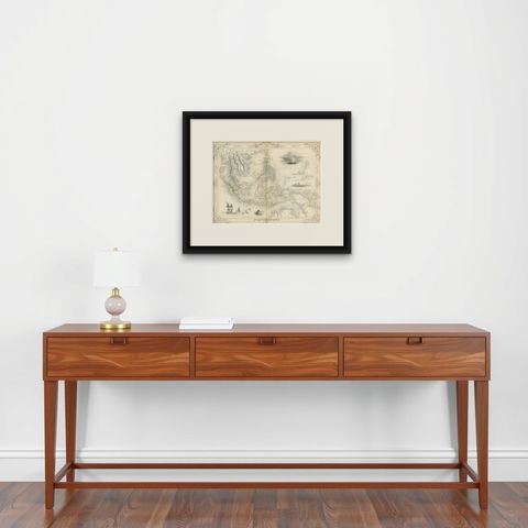 Antique Map of the Malay Archipelago with Images of Indigenous People, 1851, shown framed on a wall, true to size