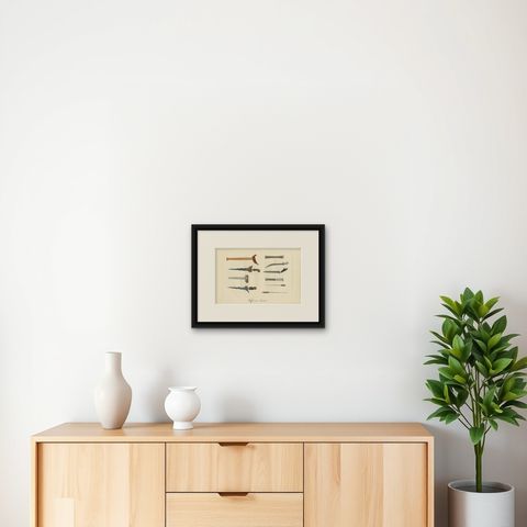 Decorative Antique Print of Traditional Weapons of the Javanese, Indonesia, 1830, shown framed on a wall, true to size