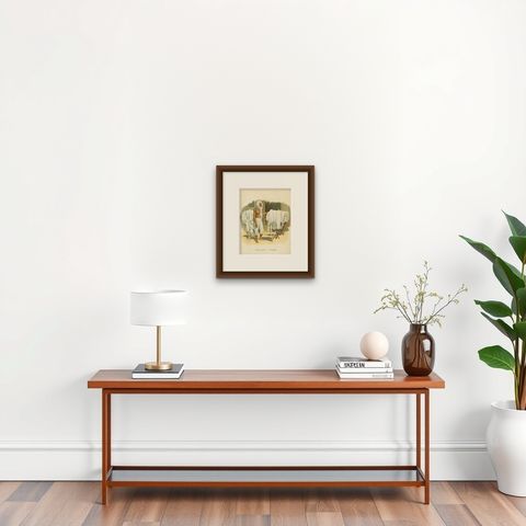 Antique Print of an Indonesian Man doing the Laundry, 1909, shown framed on a wall, true to size