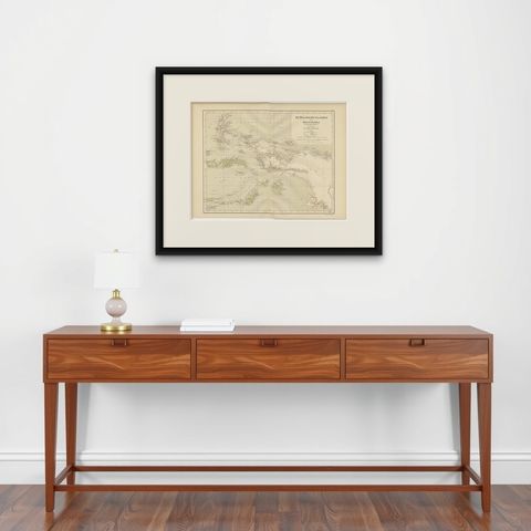 Antique Map of the Moluccas and Irian Jaya (Papua), Indonesia, 1900, shown framed on a wall, true to size