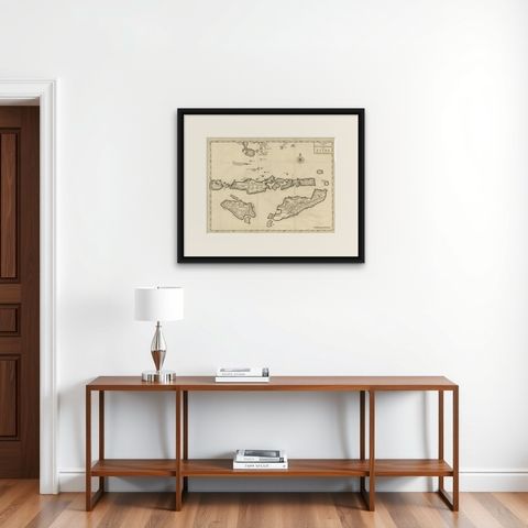 Antique Map of the Banda Islands in Indonesia by Valentijn, 1726, shown framed on a wall, true to size