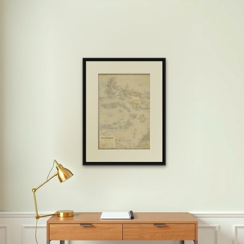 Antique Map of the Moluccas by Stemfoort, 1885, shown framed on a wall, true to size
