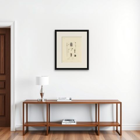 Antique Print of Artifacts from the Haven of Doreri, New Guinea, shown framed on a wall, true to size