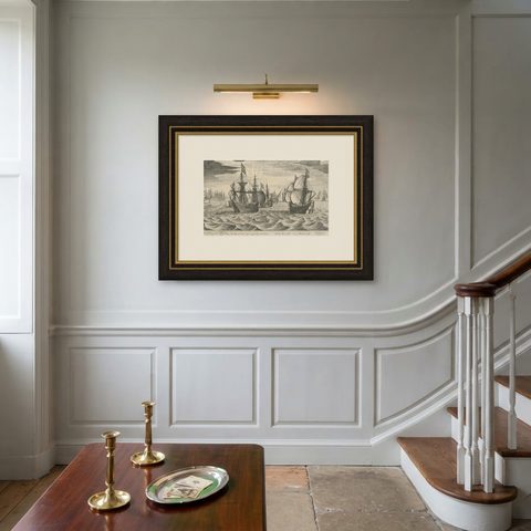 Antique Print of a Fleet of Nine Ships Departing to the East Indies '1603', shown framed on a wall, true to size