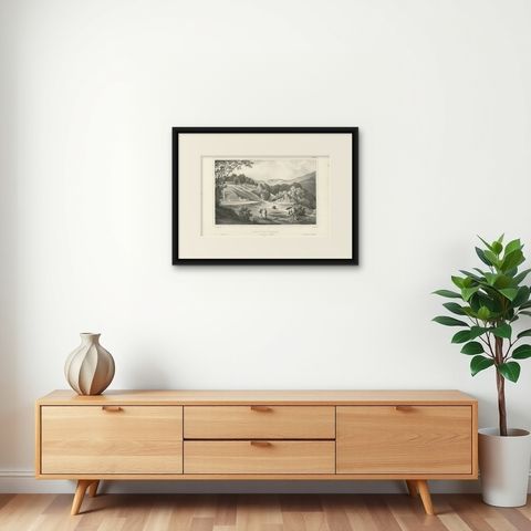 Antique Print of a Chinese Cemetery near Ambon, Indonesia by D'Urville, 1833, shown framed on a wall, true to size