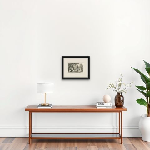 Antique Print of Dancing Warriors on Buru Island, Maluku, shown framed on a wall, true to size
