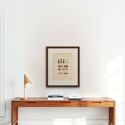 Antique Print of Artifacts from New Guinea, shown framed on a wall, true to size
