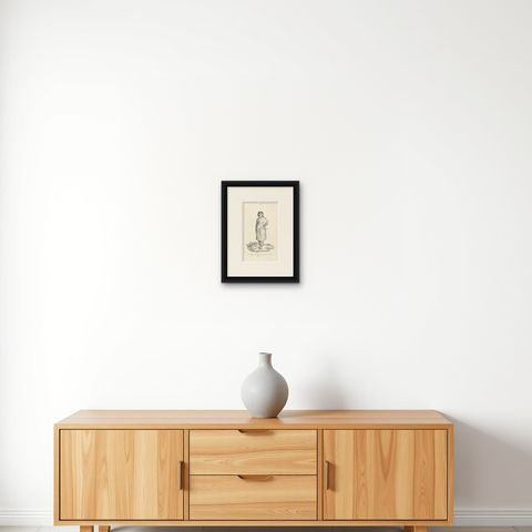 Antique Print of a Native of Timor Island 'circa 1840', shown framed on a wall, true to size