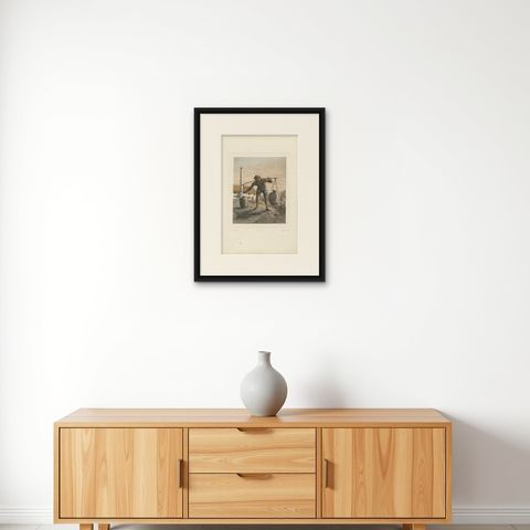 Antique Print of an Indonesian Coal Miner by Van Pers, circa 1850, shown framed on a wall, true to size