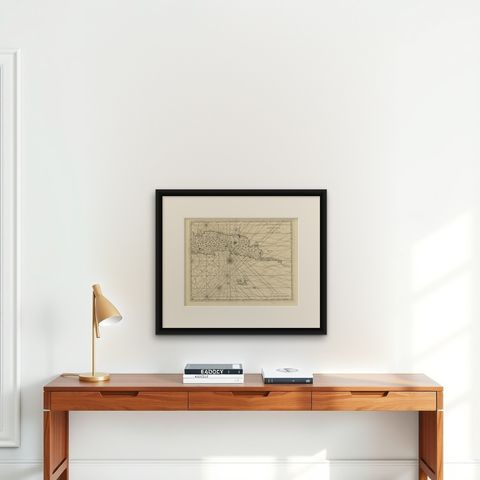 Antique Map of Ambon and Surroundings by Valentijn '1726', shown framed on a wall, true to size