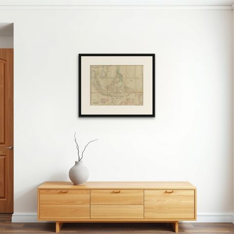 Antique Map of the Asiatic Archipelago by E. Stanford, circa 1910, shown framed on a wall, true to size